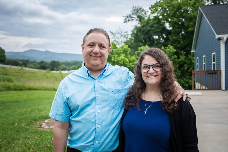Eirene Peterson and Stom Peterson outside the Peterson Insurance Group office in Weaverville, NC